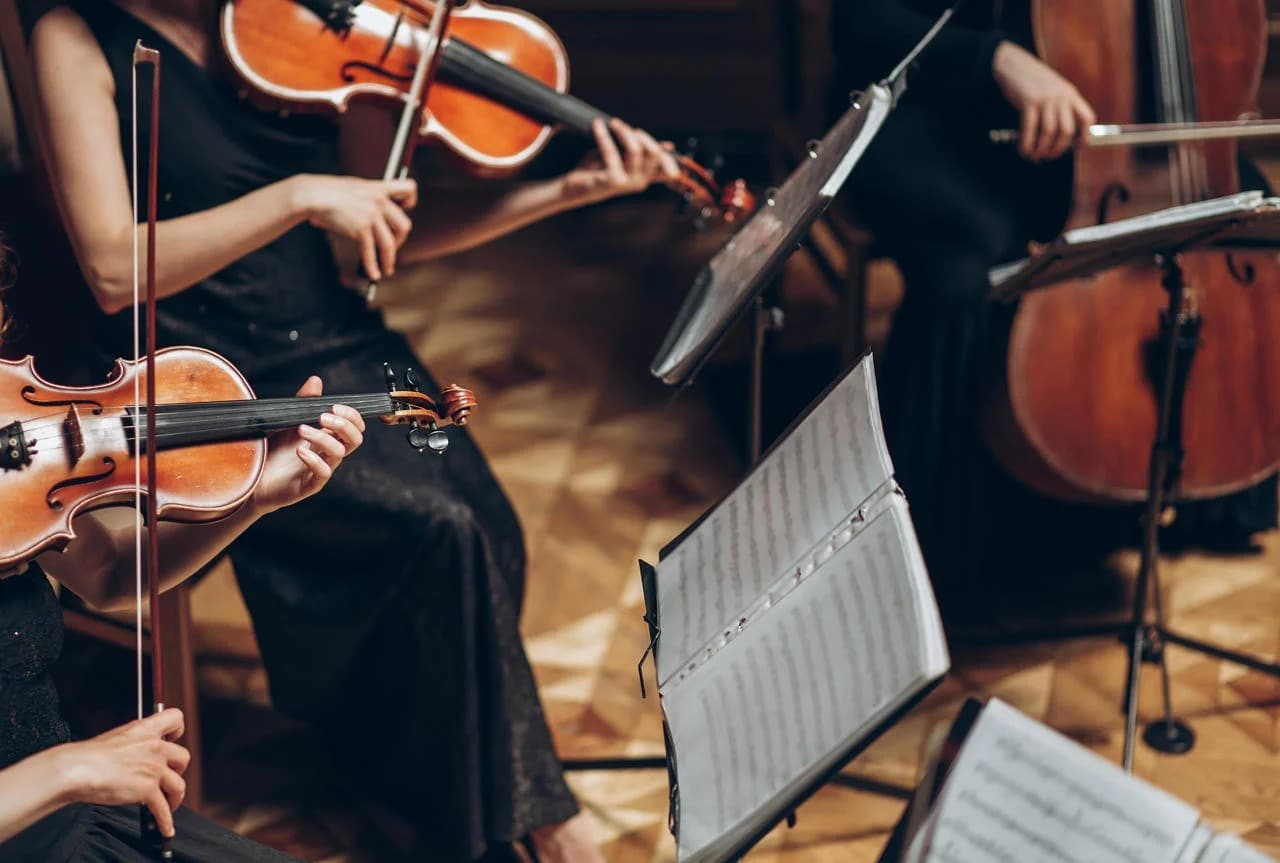 String quartet playing violins and cello in an elegant room