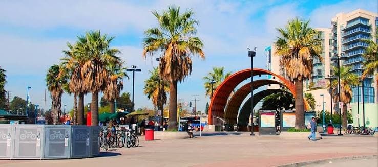 Palm-lined plaza and arched canopy at the North Hollywood transit station