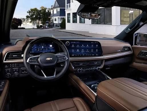 Chevrolet Suburban interior with tan leather and dual digital displays