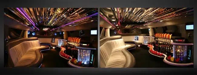 Cream leather lounge seating and lit bar inside a stretch limousine